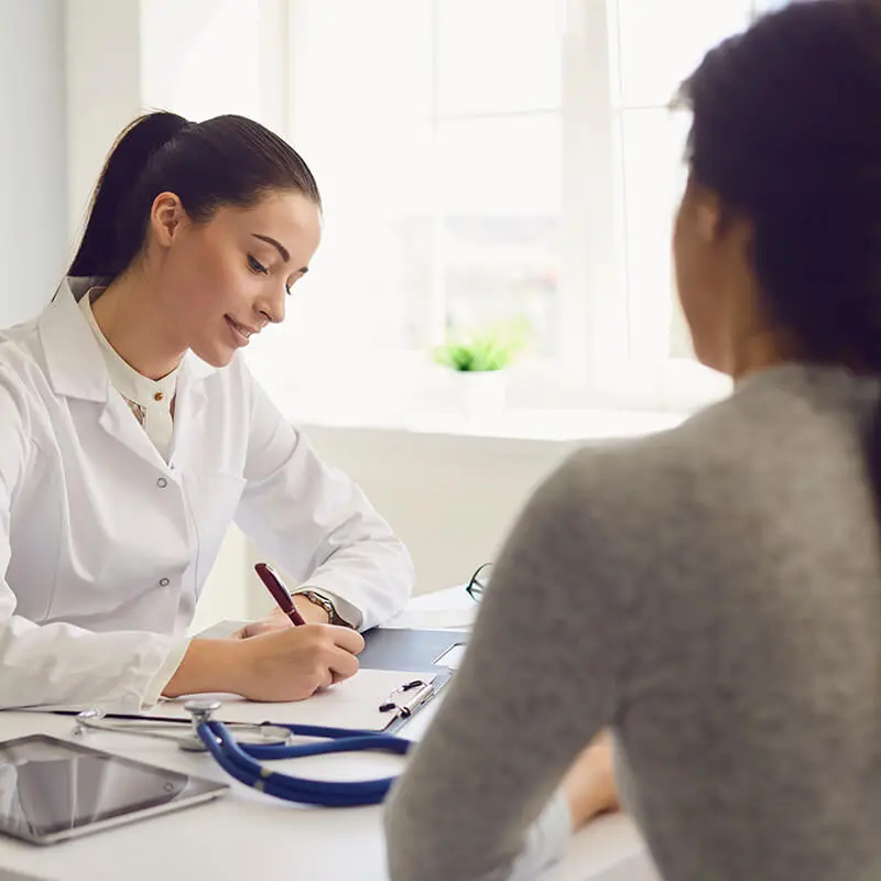 Woman consulting a doctor